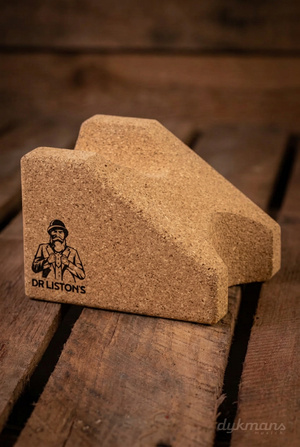 Dr. Liston's Supreme Neck Rest op een warme houten achtergrond